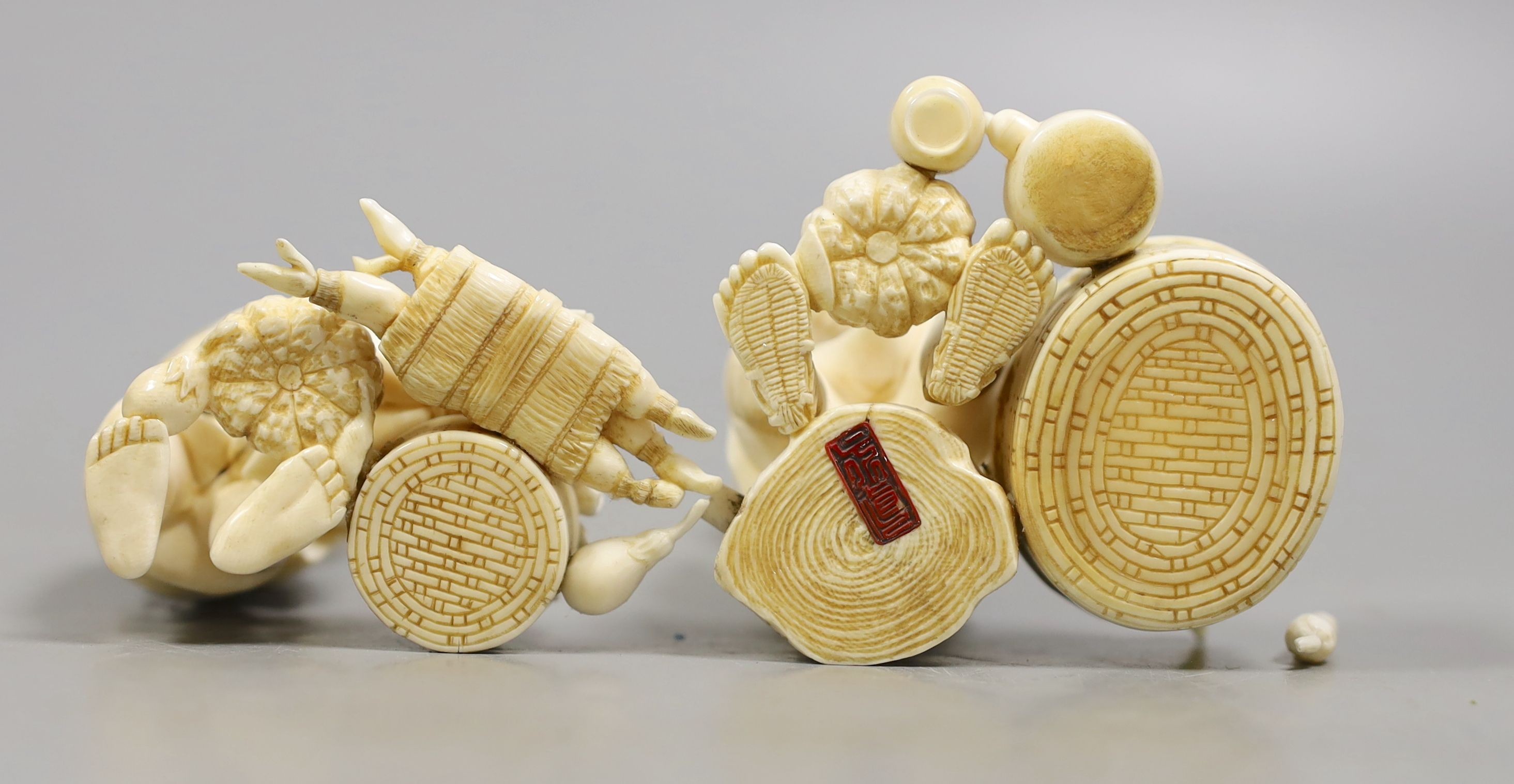 A Japanese ivory group of a farmer and boy, early 20th century, farmer 11.5 cms high.